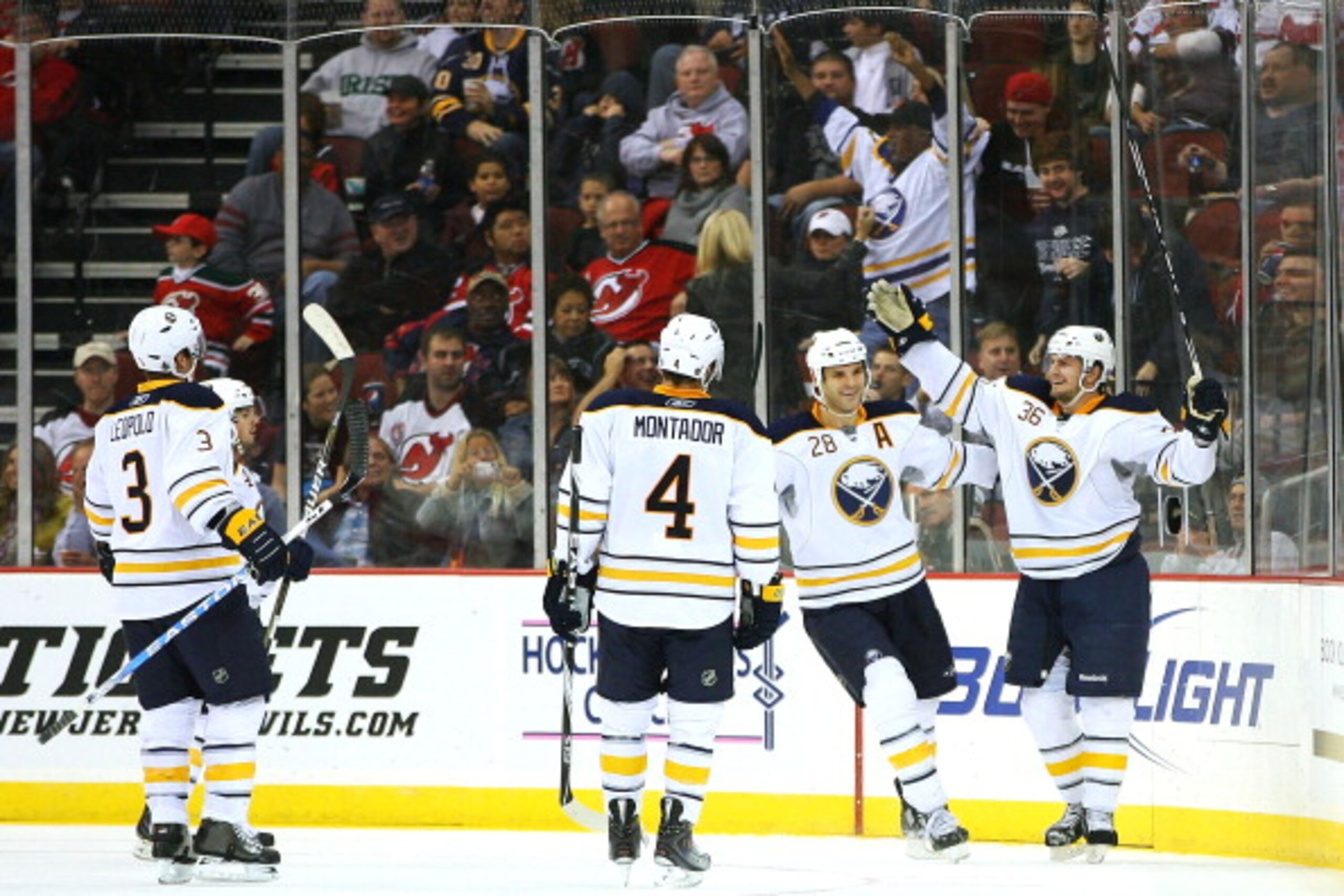 NEWARK, NJ - OCTOBER 23:  Patrick Kaleta #36 of the Buffalo Sabres (R) celebrates with teammates after scoring against the New Jersey Devils in the second period on October 23, 2010 at the Prudential Center in Newark, New Jersey.  (Photo by Andrew Burton/