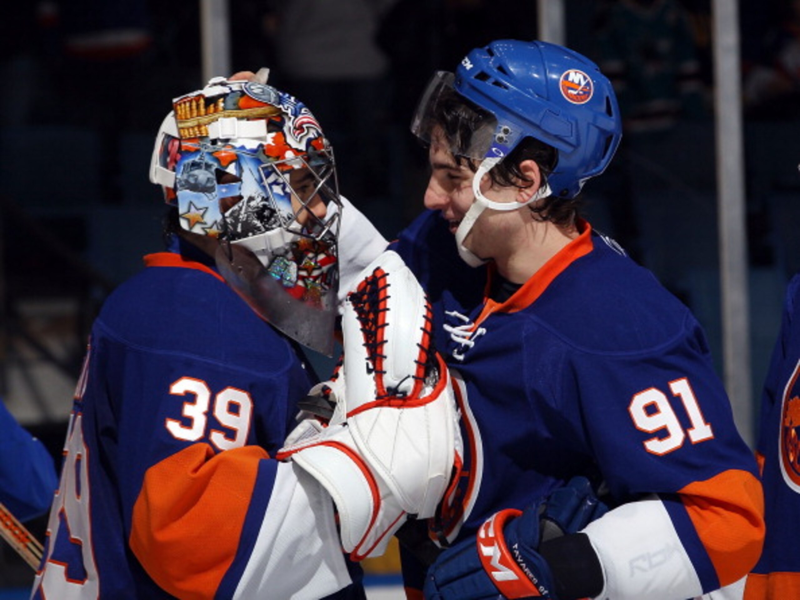 UNIONDALE, NY - JANUARY 15: Rick DiPietro #39 and John Tavares #91 of the New York Islanders celebrate their win over the Buffalo Sabres at the Nassau Coliseum on January 15, 2011 in Uniondale, New York. The Islanders defeated the Sabres 5-3. (Photo by Br