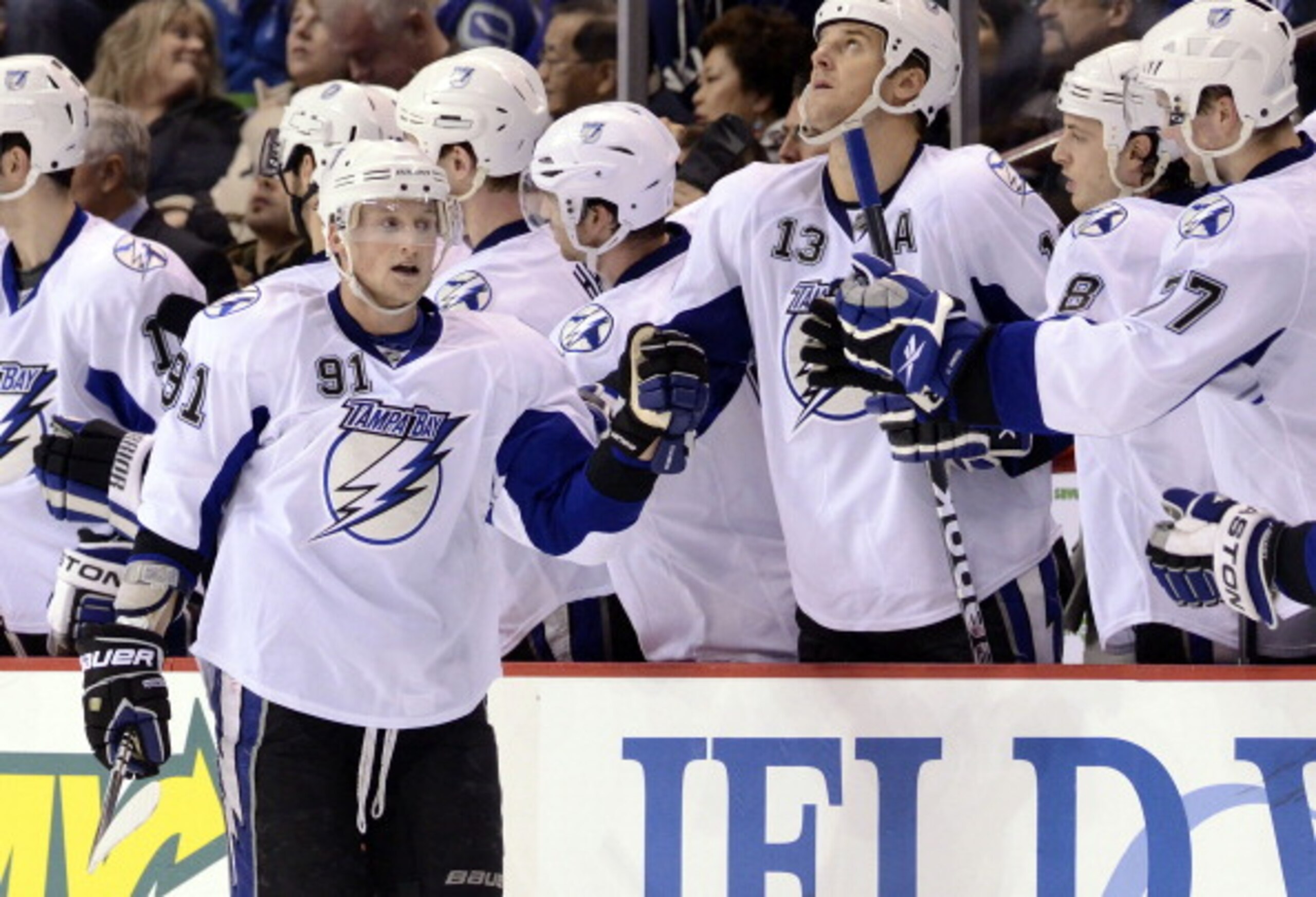 VANCOUVER, CANADA - DECEMBER 11:  Steven Stamkos #91 of the Tampa Bay Lightning is congratulated by teammates after scoring against the Vancouver Canucks during the second period in NHL action on December 11, 2010 at Rogers Arena in Vancouver, BC, Canada.