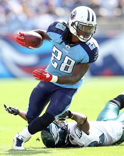 NASHVILLE, TN - OCTOBER 24:  Chris Johnson #28 of the Tennessee Titans runs with the while defended by Asante Samuel #22 of the Philadelphia Eagles at LP Field on October 24, 2010 in Nashville, Tennessee. The Titans won 37-19.  (Photo by Andy Lyons/Getty