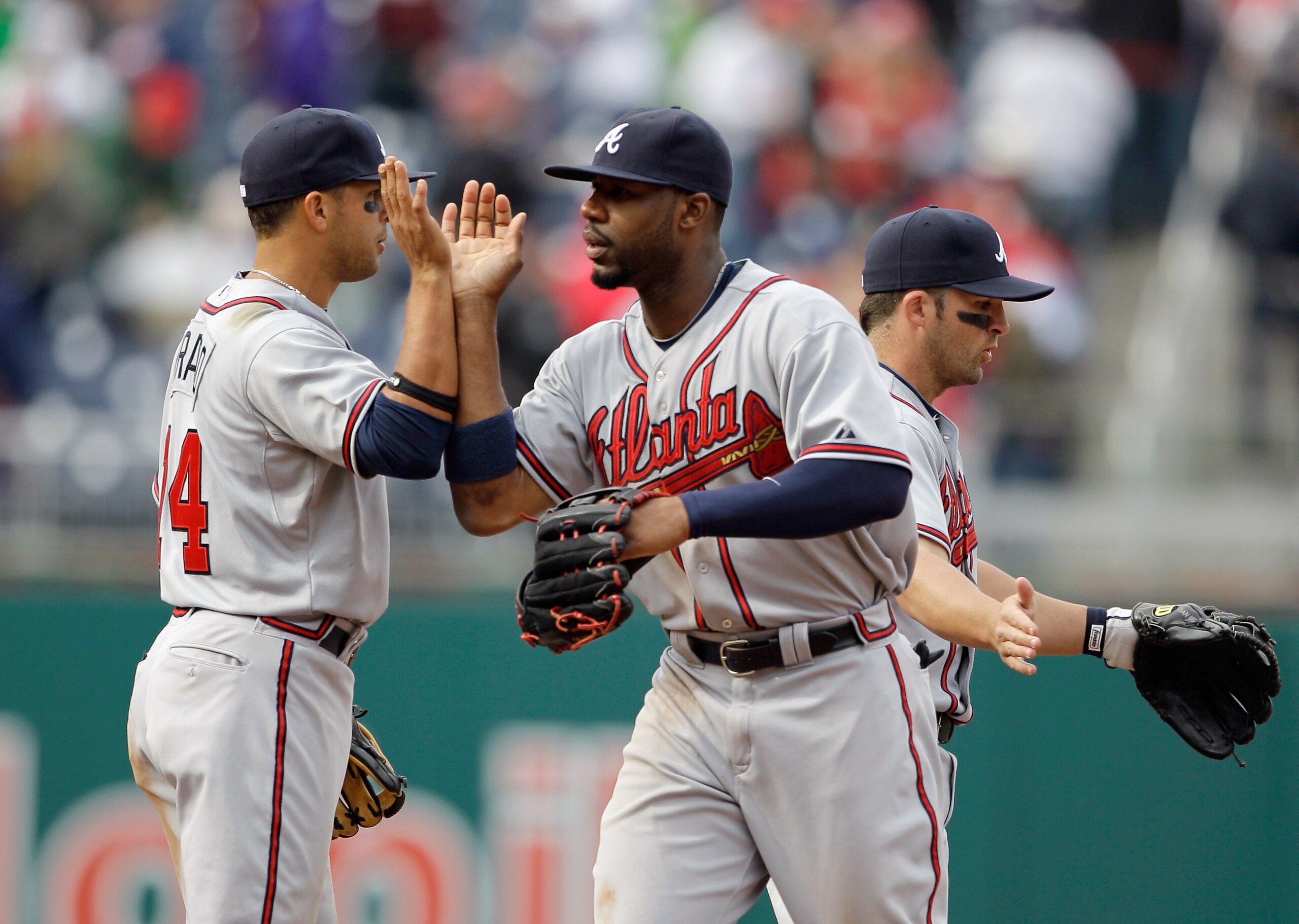 WASHINGTON, DC - APRIL 03: Martin Prado #14 of the Atlanta Braves and teammate Jason Heyward #22 celebrate after they defeated the Washington Nationals 11-2 at Nationals Park on April 3, 2011 in Washington, DC. (Photo by Rob Carr/Getty Images) WASHINGTON, DC - APRIL 03: Martin Prado #14 of the Atlanta Braves and teammate Jason Heyward #22 celebrate after they defeated the Washington Nationals 11-2 at Nationals Park on April 3, 2011 in Washington, DC. (Photo by Rob Carr/Getty Images)