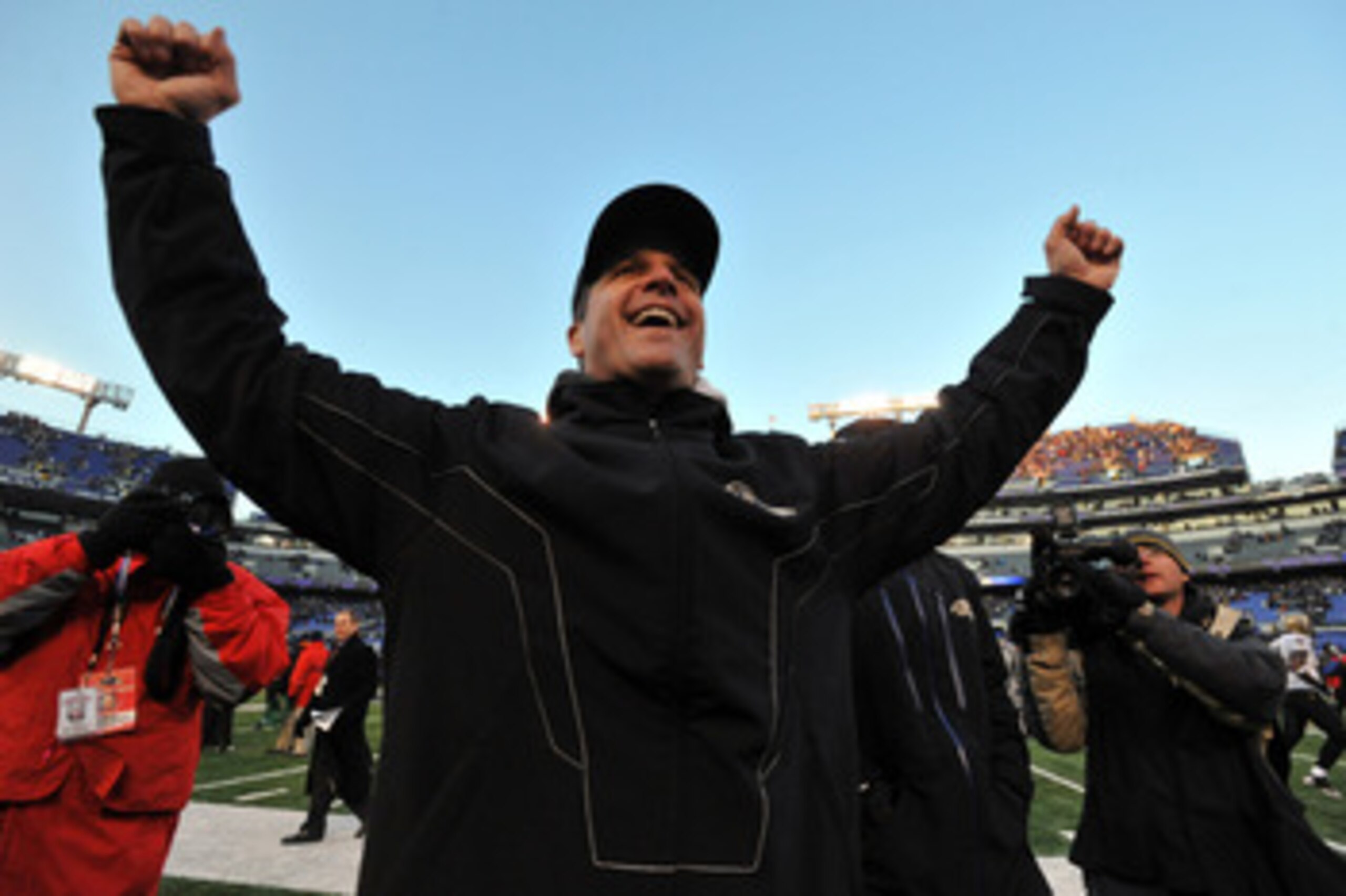 BALTIMORE, MD - DECEMBER 19: Head coach John Harbaugh of the Baltimore Ravens celebrates the Ravens victory as he walks off the field after the game against the New Orleans Saints at M&T Bank Stadium on December 19, 2010 in Baltimore, Maryland. The Rave BALTIMORE, MD - DECEMBER 19: Head coach John Harbaugh of the Baltimore Ravens celebrates the Ravens victory as he walks off the field after the game against the New Orleans Saints at M&T Bank Stadium on December 19, 2010 in Baltimore, Maryland. The Rave