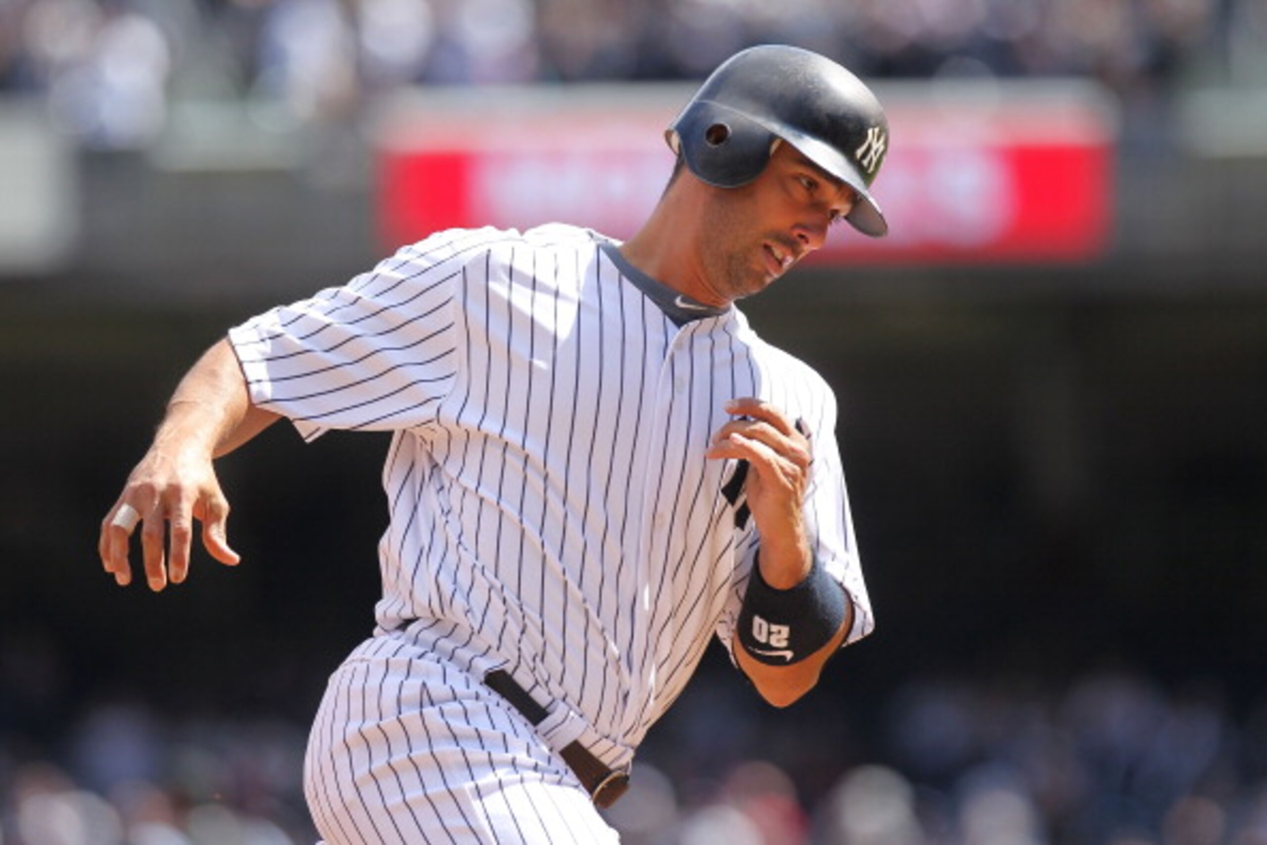 NEW YORK, NY - APRIL 03:  Jorge Posada #20 of the New York Yankees rounds the bases after hitting a two run home run against the Detroit Tigers at Yankee Stadium on April 3, 2011 in the Bronx borough of New York City.  (Photo by Nick Laham/Getty Images)