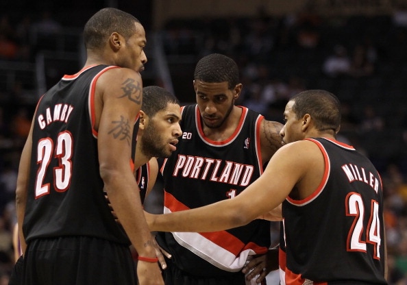 PHOENIX, AZ - JANUARY 14: (L-R) Marcus Camby #23, Nicolas Batum #88, LaMarcus Aldridge #12 and Andre Miller #24 of the Portland Trail Blazers huddle up during the NBA game against the Phoenix Suns at US Airways Center on January 14, 2011 in Phoenix, Arizo