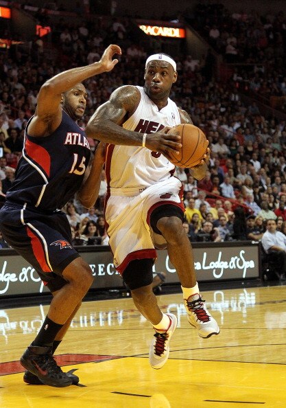 MIAMI, FL - JANUARY 18:  LeBron James #6 of the Miami Heat is guarded by Al Horford #15 of the Atlanta Hawks during a game at American Airlines Arena on January 18, 2011 in Miami, Florida. NOTE TO USER: User expressly acknowledges and agrees that, by down