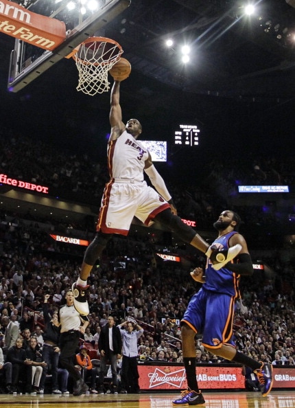 MIAMI - DECEMBER 28:  Guard Dwyane Wade #3 of the Miami Heat dunks against the New York Knicks at American Airlines Arena on December 28, 2010 in Miami, Florida. Wade had 40 points as the Heat defeated the Knicks 106-98.  (Photo by Marc Serota/Getty Image