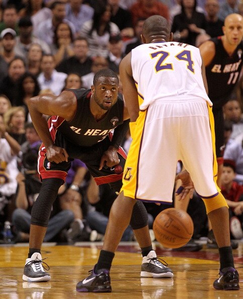 MIAMI, FL - MARCH 10:  Dwyane Wade #3 of the Miami Heat defends Kobe Bryant #24 of the Los Angeles Lakers during a game at American Airlines Arena on March 10, 2011 in Miami, Florida. NOTE TO USER: User expressly acknowledges and agrees that, by downloadi