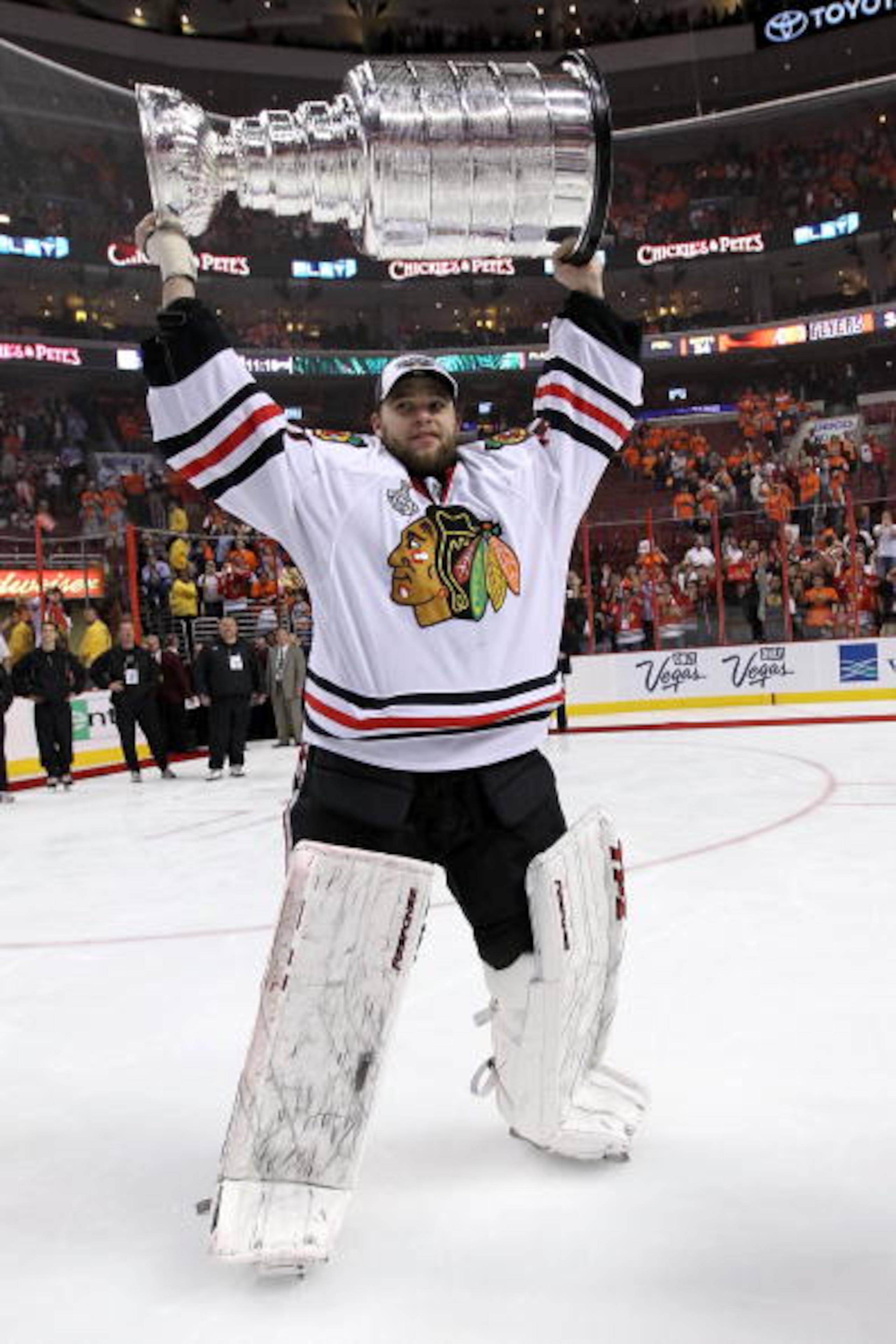 PHILADELPHIA - JUNE 09:  Antti Niemi #31 of the Chicago Blackhawks hoists the Stanley Cup after teammate Patrick Kane #88 scored the game-winning goal in overtime to defeat the Philadelphia Flyers 4-3 and win the Stanley Cup in Game Six of the 2010 NHL St