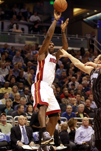 ORLANDO, FL - FEBRUARY 03:  Forward LeBron James #6 of the Miami Heat shoots against the Orlando Magic at Amway Arena on February 3, 2011 in Orlando, Florida. NOTE TO USER: User expressly acknowledges and agrees that, by downloading and or using this phot