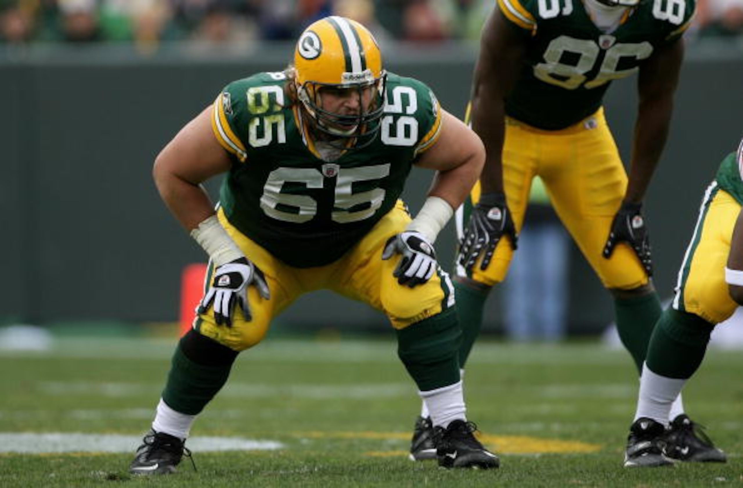 GREEN BAY, WI - NOVEMBER 16:  Offensive tackle Mark Tauscher #65 of the Green Bay Packers is ready to protect the line of scrimmage against the Chicago Bears during NFL action at Lambeau Field on November 16, 2008 in Green Bay, Wisconsin. The Packers defe