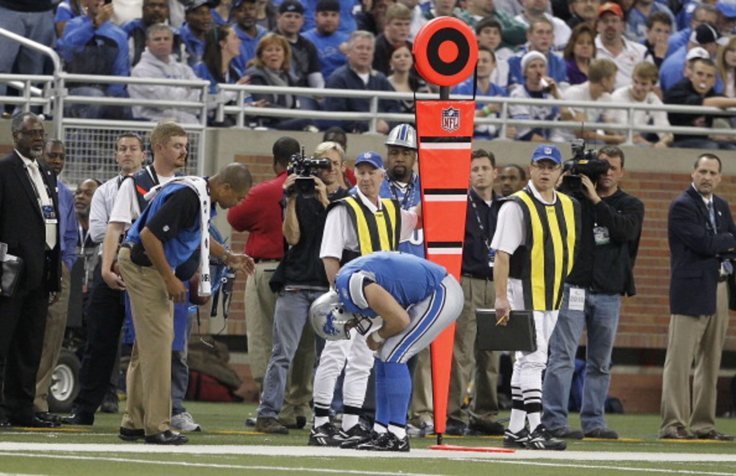DETROIT - NOVEMBER 07: Matthew Stafford #9 of the Detroit Lions bends over in pain against the New York Jets during the third quarter of the game at Ford Field on November 7, 2010 in Detroit, Michigan. The Jets defeated the Lions 23-20 in overtime. (Pho DETROIT - NOVEMBER 07: Matthew Stafford #9 of the Detroit Lions bends over in pain against the New York Jets during the third quarter of the game at Ford Field on November 7, 2010 in Detroit, Michigan. The Jets defeated the Lions 23-20 in overtime. (Pho