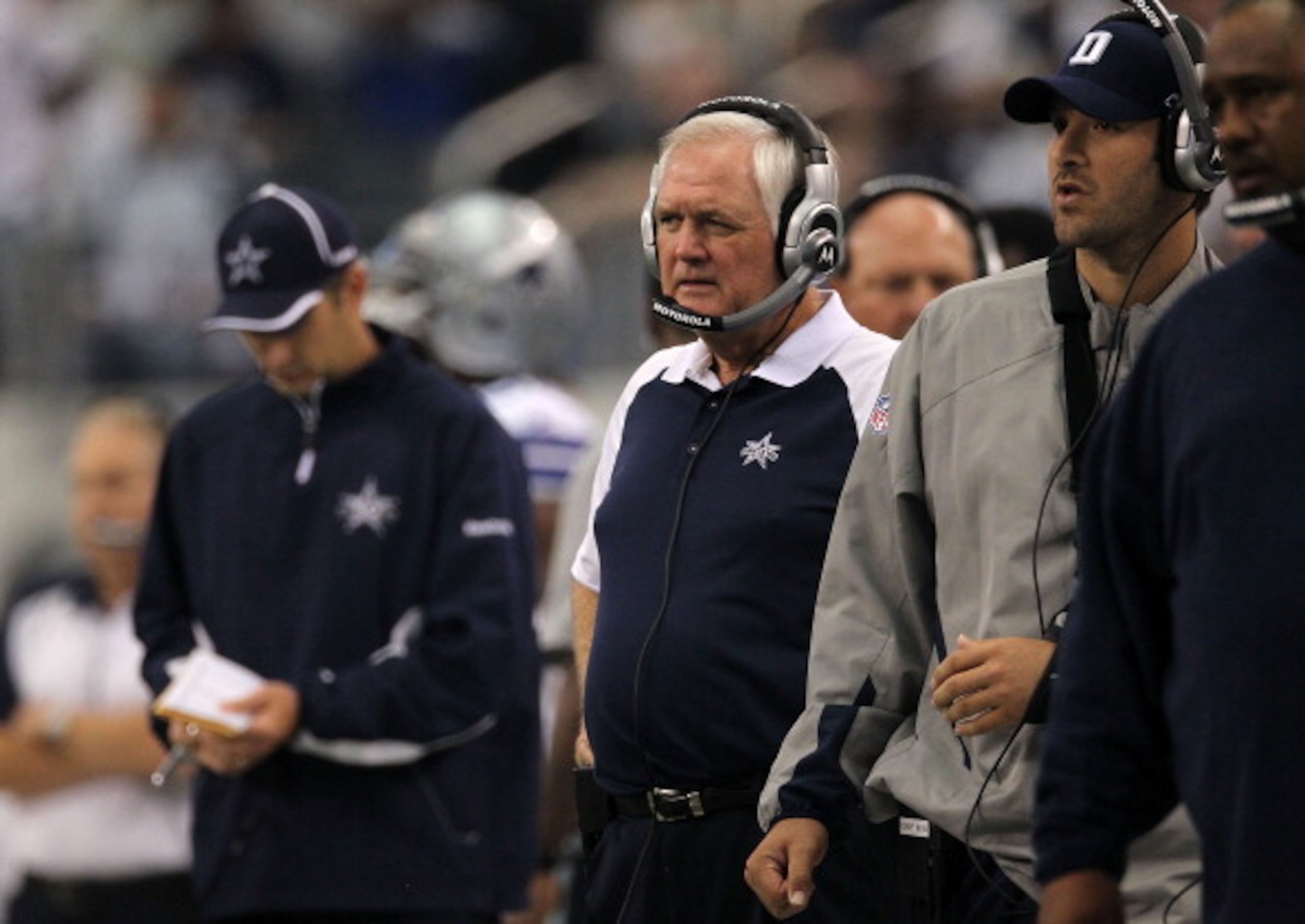 ARLINGTON, TX - OCTOBER 31: Head coach Wade Phillips (C) and injured quarterback Tony Romo (R) of the Dallas Cowboys look on against the Jacksonville Jaguars at Cowboys Stadium on October 31, 2010 in Arlington, Texas. (Photo by Ronald Martinez/Getty Ima ARLINGTON, TX - OCTOBER 31: Head coach Wade Phillips (C) and injured quarterback Tony Romo (R) of the Dallas Cowboys look on against the Jacksonville Jaguars at Cowboys Stadium on October 31, 2010 in Arlington, Texas. (Photo by Ronald Martinez/Getty Ima
