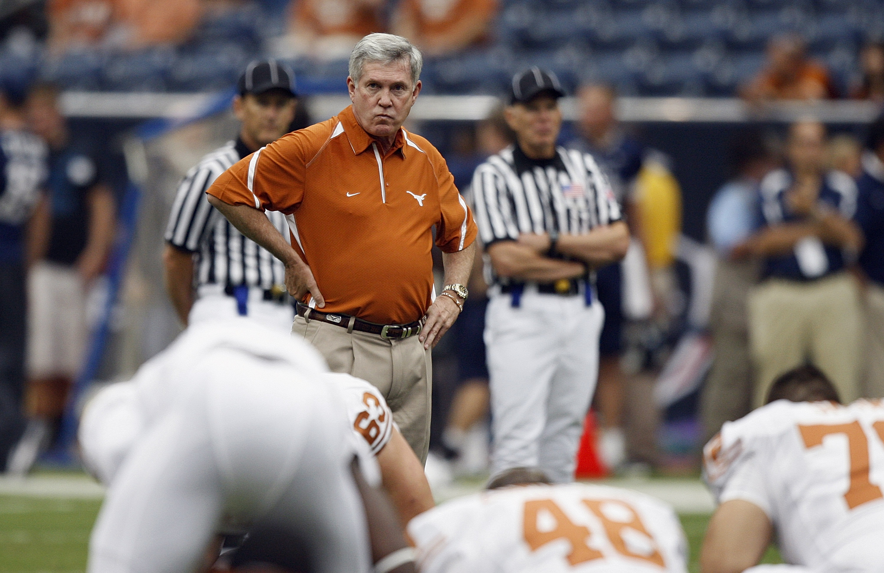HOUSTON - SEPTEMBER 04:  Head coach Mack Brown of the Texas Longhorns looks over the team during warm ups before playing the Rice Owls at Reliant Stadium on September 4, 2010 in Houston, Texas. Texas beat Rice 34-17.  (Photo by Bob Levey/Getty Images)
