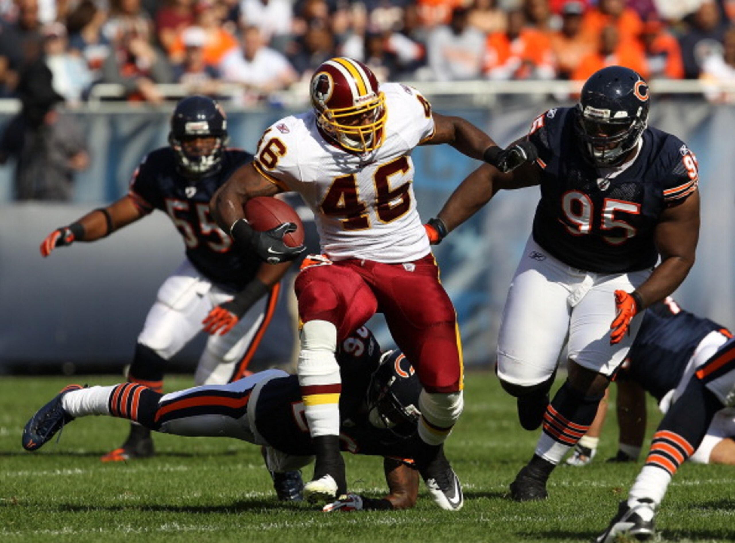 CHICAGO - OCTOBER 24: Ryan Torain #46 of the Washington Redskins runs past Tim Jennings #26 and Anthony Adams #95 of the Chicago Bears at Soldier Field on October 24, 2010 in Chicago, Illinois. The Redskins defeated the Bears 17-14. (Photo by Jonathan Dan