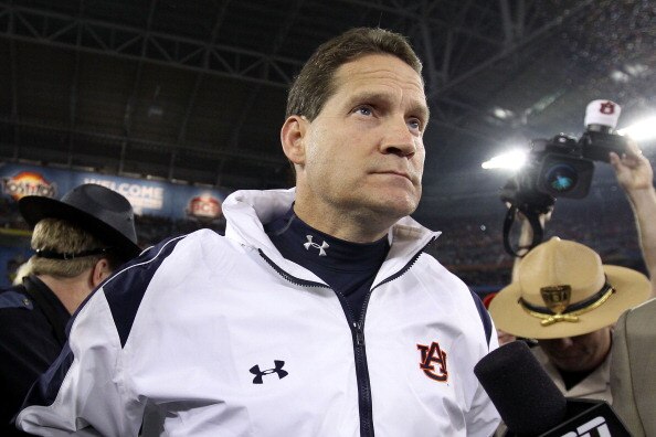 GLENDALE, AZ - JANUARY 10:  Head coach Gene Chizik of the Auburn Tigers celebrates the Tigers 22-19 victory against the Oregon Ducks during the Tostitos BCS National Championship Game at University of Phoenix Stadium on January 10, 2011 in Glendale, Arizo