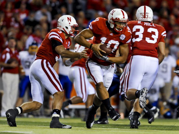 LINCOLN, NEBRASKA - SEPTEMBER 25: Nebraska Cornhuskers quarterback Taylor Martinez #3 hands the ball to running back Roy Helu Jr. #10 during second half action of their game at Memorial Stadium on September 25, 2010 in Lincoln, Nebraska. Nebraska Defeated
