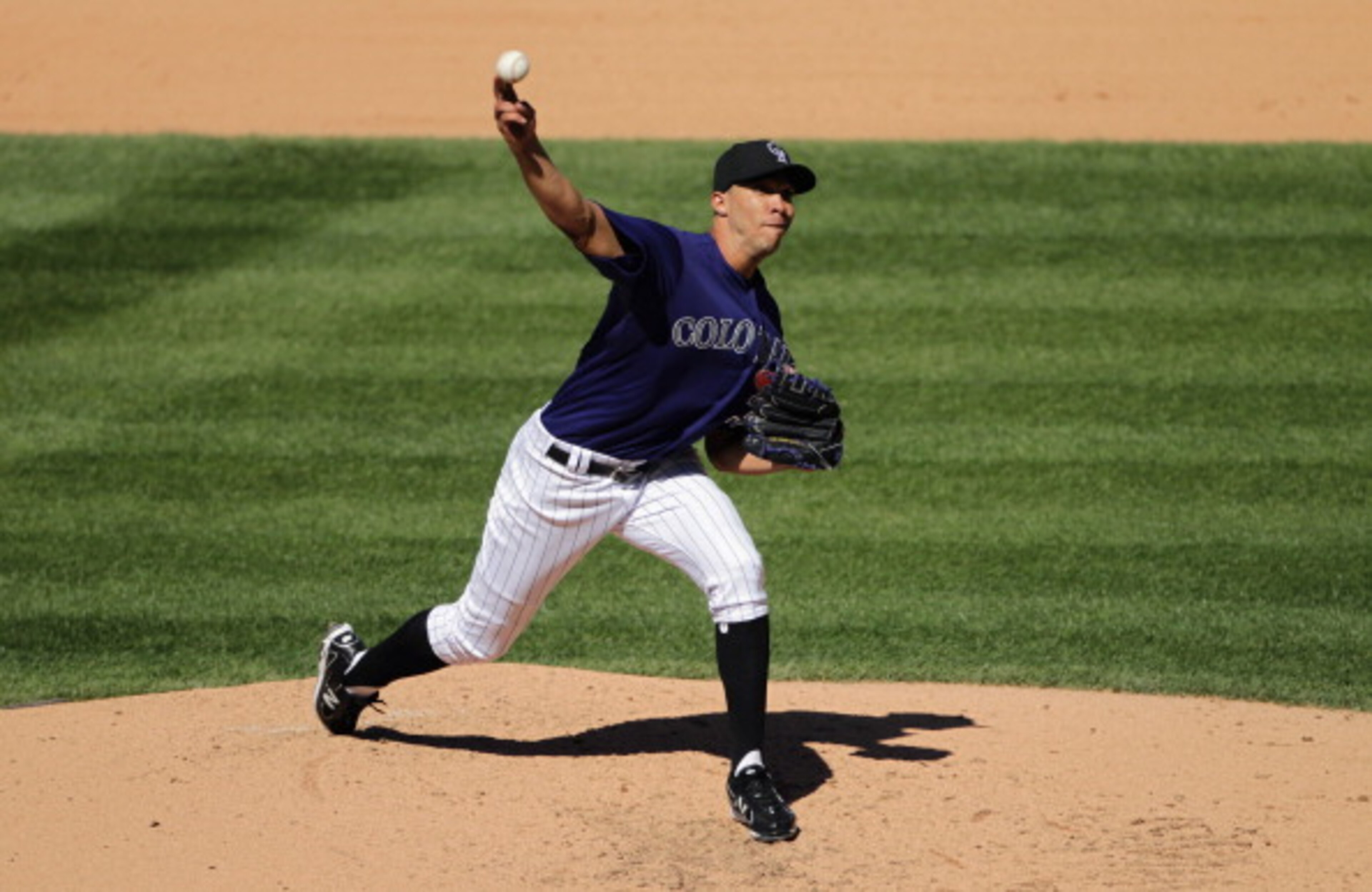 DENVER, CO - APRIL 01: Starting pitcher Ubaldo Jimenez #38 of the Colorado Rockies delivers against the Arizona Diamondbacks during Opening Day at Coors Field on April 1, 2011 in Denver, Colorado. (Photo by Doug Pensinger/Getty Images) DENVER, CO - APRIL 01: Starting pitcher Ubaldo Jimenez #38 of the Colorado Rockies delivers against the Arizona Diamondbacks during Opening Day at Coors Field on April 1, 2011 in Denver, Colorado. (Photo by Doug Pensinger/Getty Images)