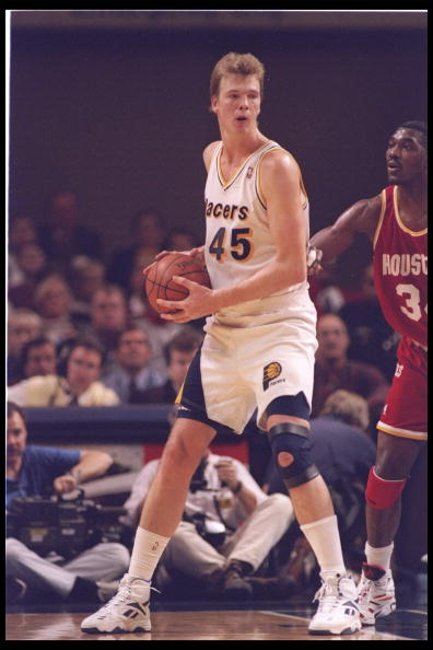 9 Nov 1994:  Center Rik Smits of the Indiana Pacers looks to pass the ball during a game against the Houston Rocket at Market Square Arena in Indianapolis, Indiana.  The Rockets won the game, 109-104. Mandatory Credit: Allsport  /Allsport