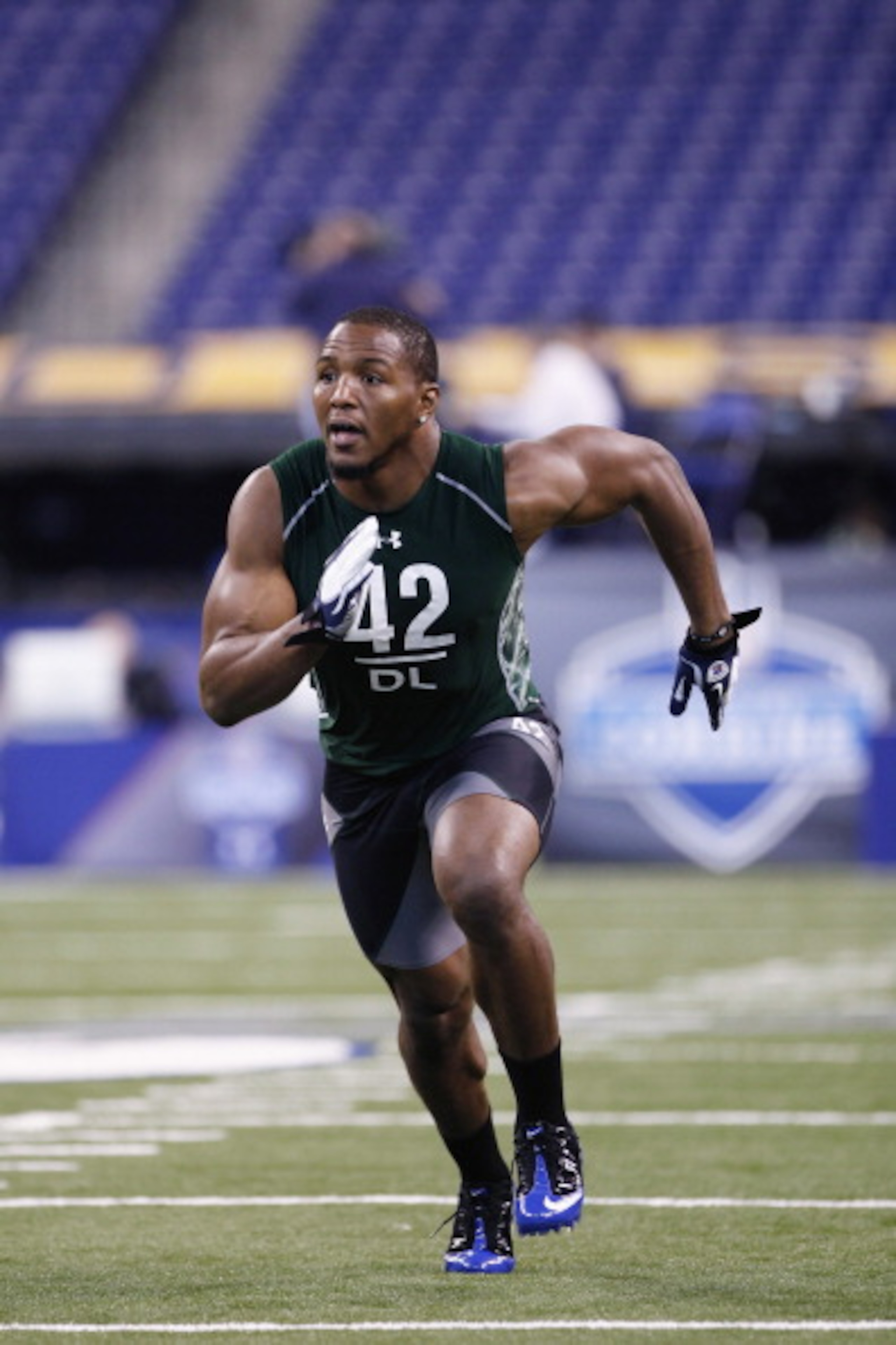 INDIANAPOLIS, IN - FEBRUARY 28: Defensive lineman Robert Quinn of North Carolina runs through a drill during the 2011 NFL Scouting Combine at Lucas Oil Stadium on February 28, 2011 in Indianapolis, Indiana. (Photo by Joe Robbins/Getty Images) INDIANAPOLIS, IN - FEBRUARY 28: Defensive lineman Robert Quinn of North Carolina runs through a drill during the 2011 NFL Scouting Combine at Lucas Oil Stadium on February 28, 2011 in Indianapolis, Indiana. (Photo by Joe Robbins/Getty Images)