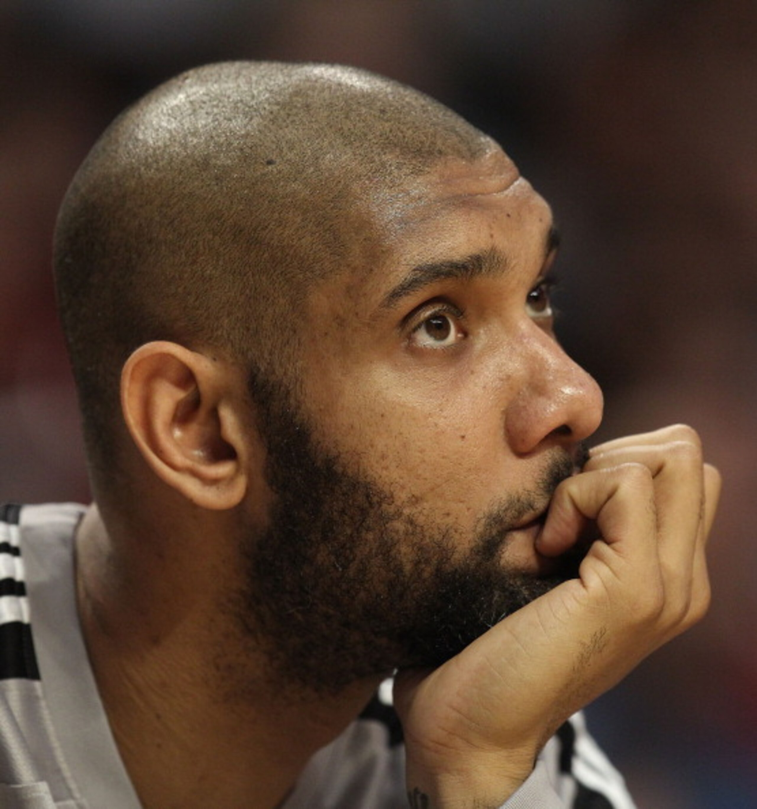 CHICAGO, IL - FEBRUARY 17: Tim Duncan #21 of the San Antonio Spurs watches from the bench as his teammates take on the Chicago Bulls at the United Center on February 17, 2011 in Chicago, Illinois. The Bulls defeated the Spurs 109-99. NOTE TO USER: User ex