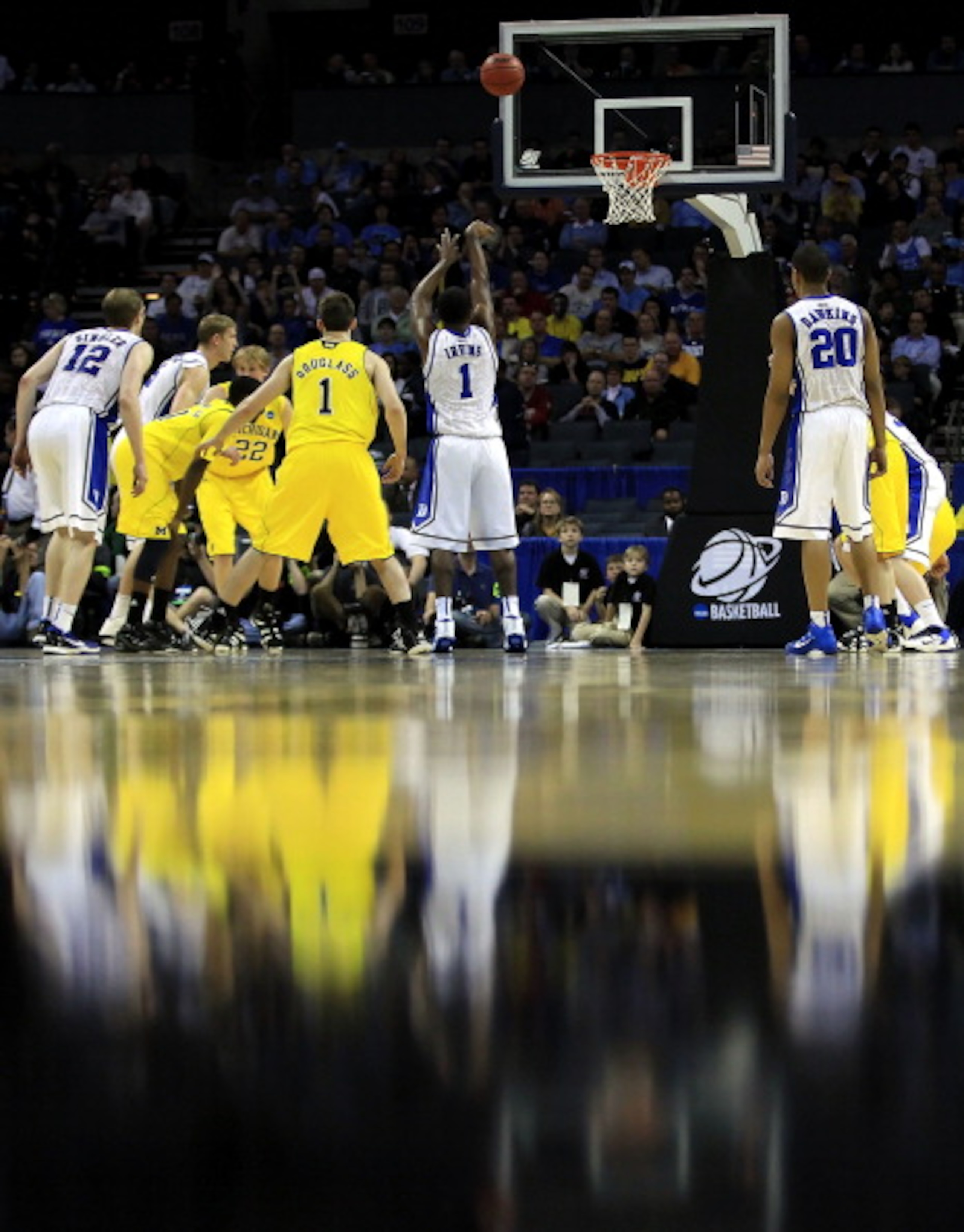 CHARLOTTE, NC - MARCH 20:  Kyrie Irving #1 of the Duke Blue Devils shoots a free throw while taking on the Michigan Wolverines during the third round of the 2011 NCAA men's basketball tournament at Time Warner Cable Arena on March 20, 2011 in Charlotte, N