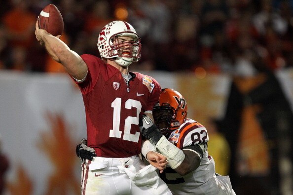 MIAMI, FL - JANUARY 03: Andrew Luck #12 of the Stanford Cardinal throws a pass against Steven Friday #82 of the Virginia Tech Hokies during the 2011 Discover Orange Bowl at Sun Life Stadium on January 3, 2011 in Miami, Florida. (Photo by Streeter Lecka/Ge