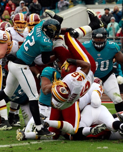 JACKSONVILLE, FL - DECEMBER 26:  Ryan Torain #46 of the Washington Redskins dives for a touchdown over Don Carey #22 of the Jacksonville Jaguars during the game at EverBank Field on December 26, 2010 in Jacksonville, Florida.  (Photo by Sam Greenwood/Gett