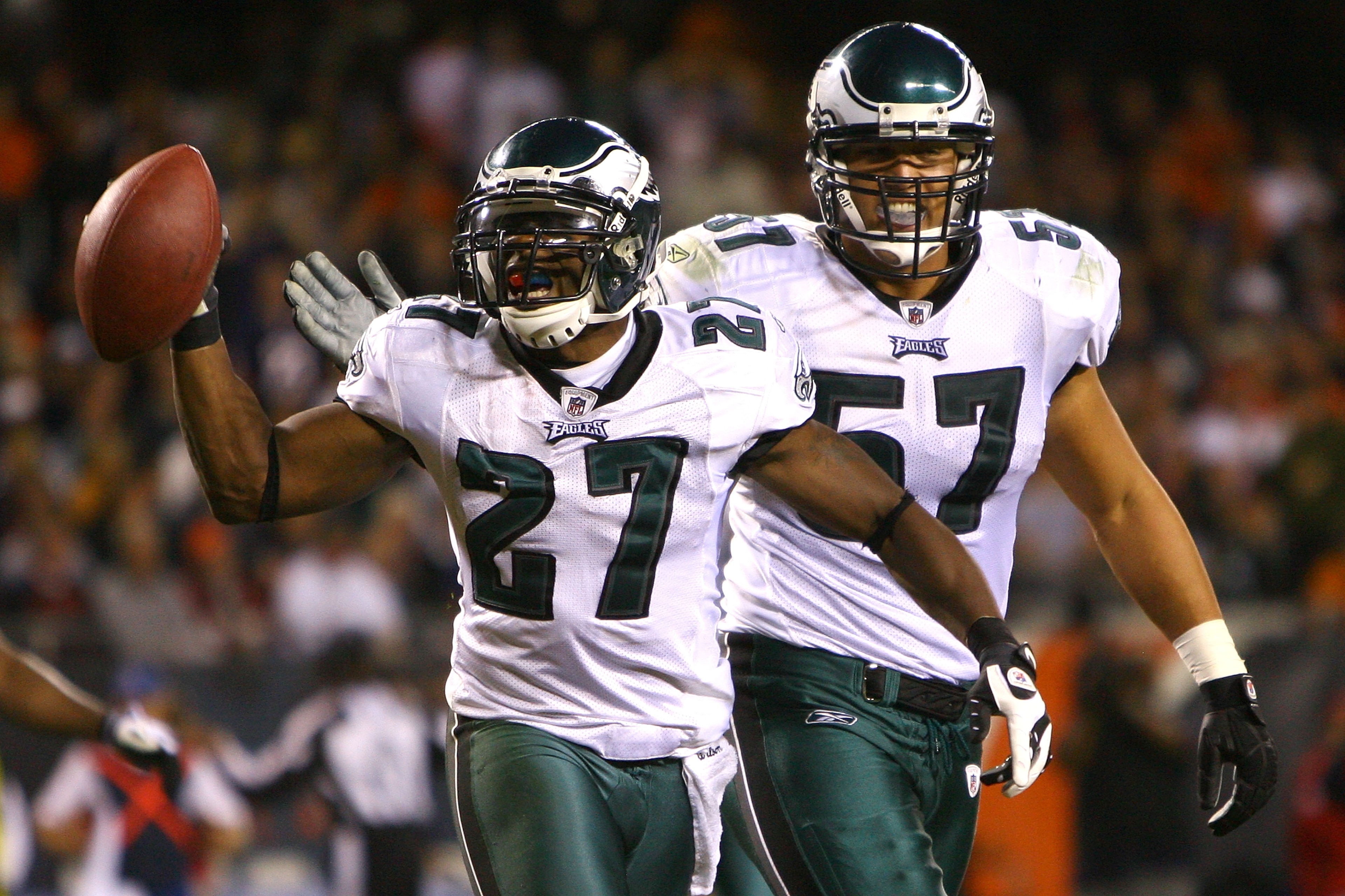 CHICAGO - SEPTEMBER 28:  (L-R) Quintin Mikell #27 and Chris Gocong #57 of the Philadelphia Eagles celebrate after Mikell intercepted a pass in the third quarter against the Chicago Bears at Soldier Field on September 28, 2008 in Chicago, Illinois.  (Photo