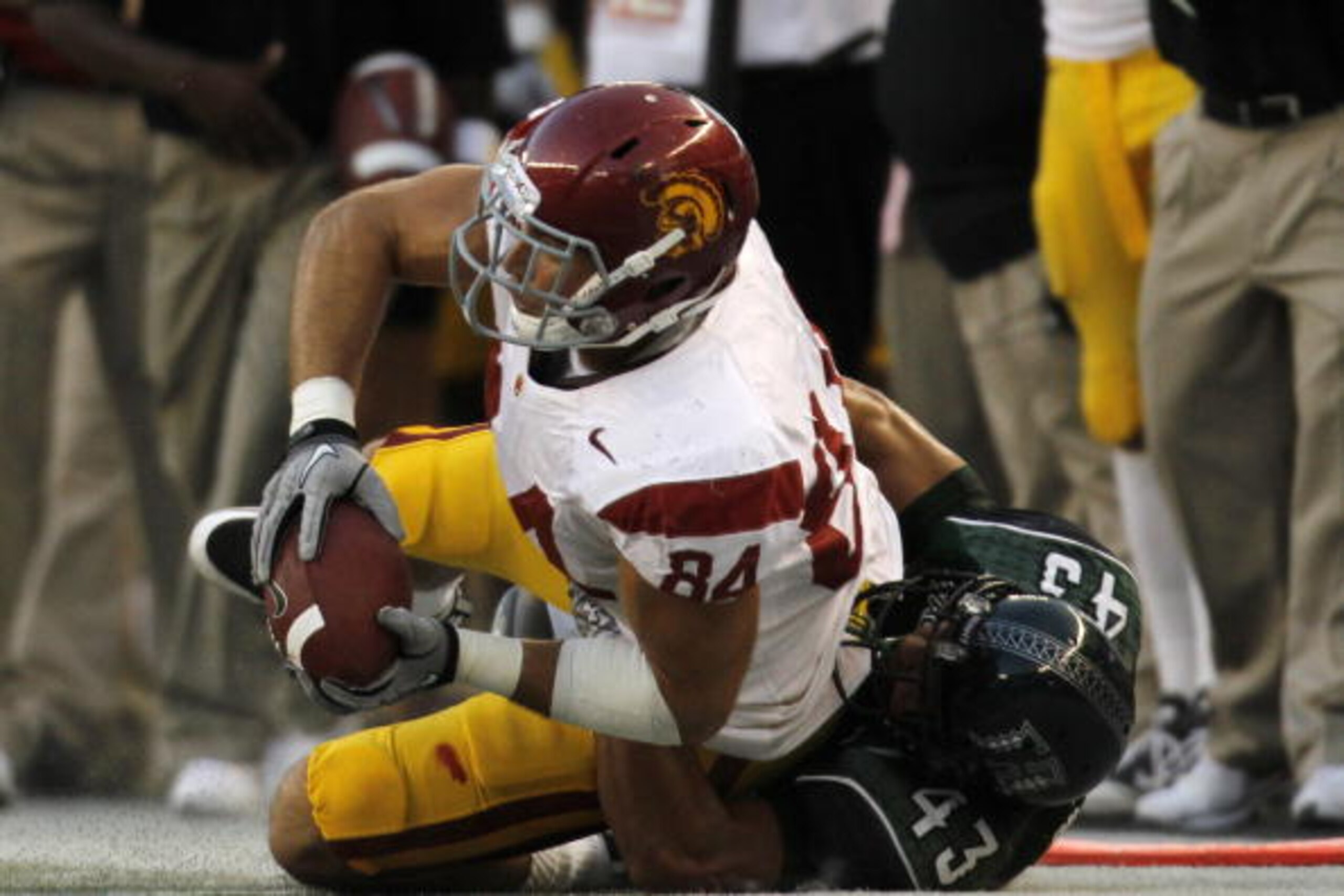 HONOLULU - SEPTEMBER 02: Jordan Cameron #84 of the University of Southern Carolina Trojans is taken down by Mana Silva #43 of the University of Hawaii Warriors during first half action at Aloha Stadium September 2, 2010 in Honolulu, Hawaii. (Photo by Kent HONOLULU - SEPTEMBER 02: Jordan Cameron #84 of the University of Southern Carolina Trojans is taken down by Mana Silva #43 of the University of Hawaii Warriors during first half action at Aloha Stadium September 2, 2010 in Honolulu, Hawaii. (Photo by Kent