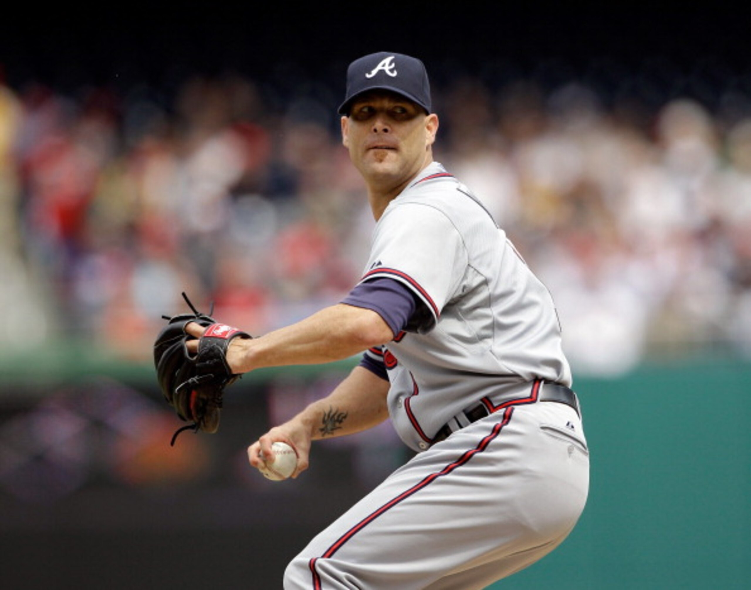 WASHINGTON, DC - APRIL 03:  Starting pitcher Tim Hudson #15 of the Atlanta Braves delivers to a Washington Nationals batter at Nationals Park on April 3, 2011 in Washington, DC.  (Photo by Rob Carr/Getty Images)