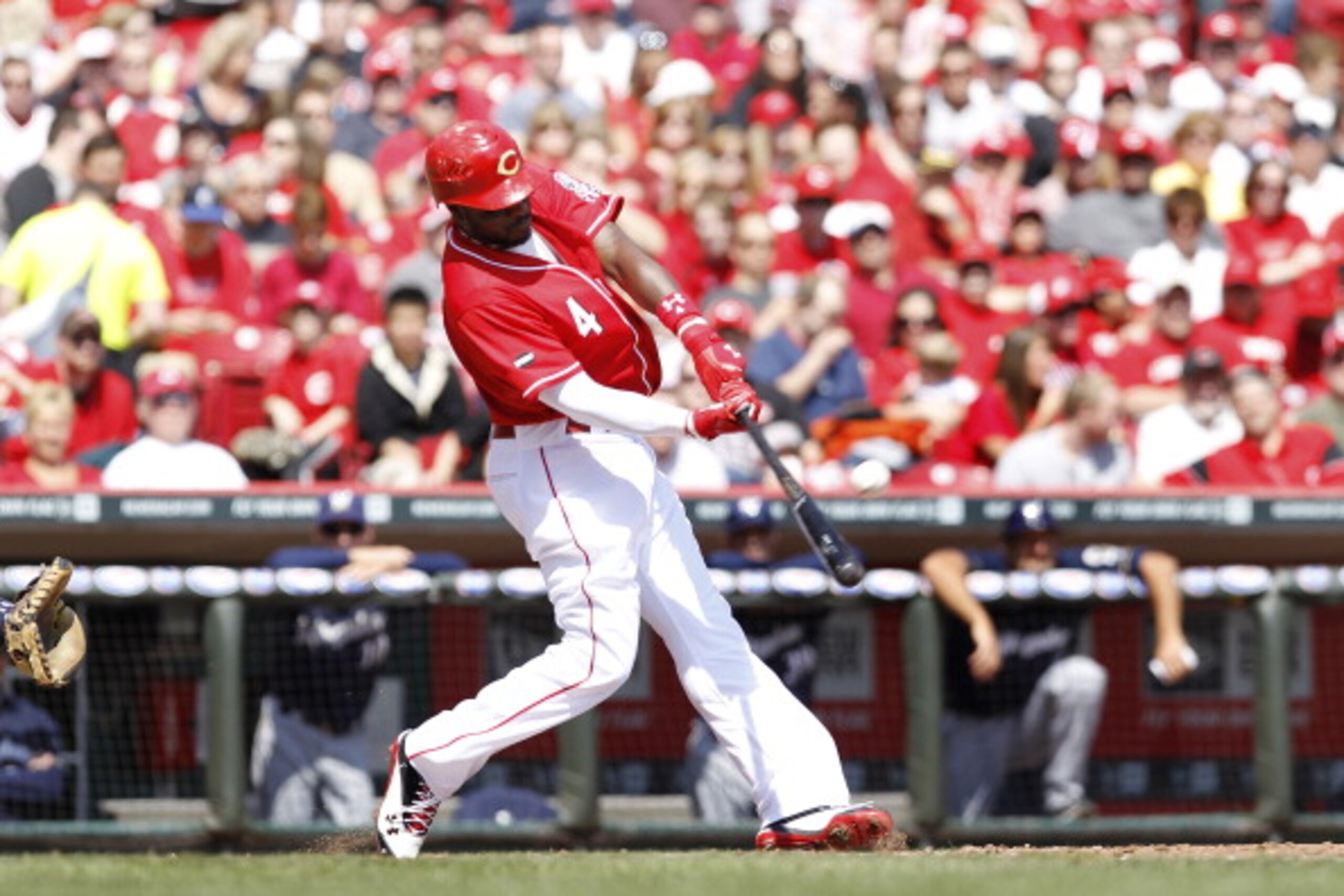 CINCINNATI, OH - APRIL 3: Brandon Phillips #4 of the Cincinnati Reds hits a three-run home run in the 4th inning against the Milwaukee Brewers at Great American Ball Park on April 3, 2011 in Cincinnati, Ohio. The Reds won 12-3. (Photo by Joe Robbins/Getty