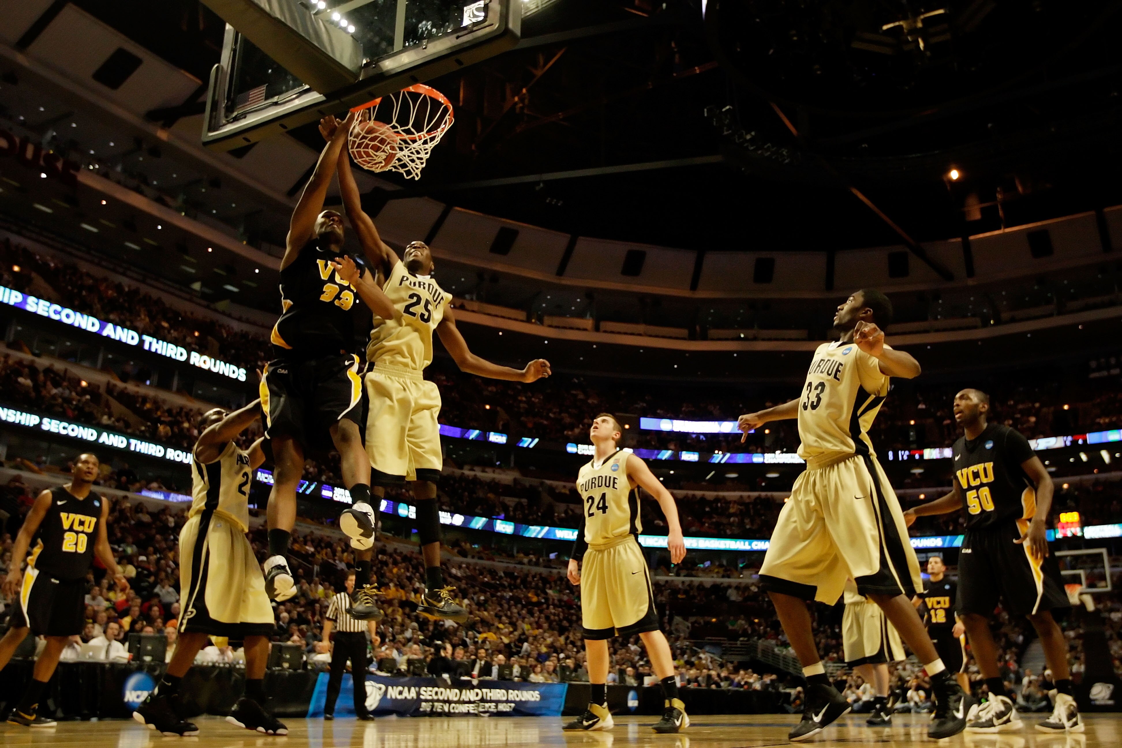 CHICAGO, IL - MARCH 20: Rob Brandenberg #23 of the Virginia Commonwealth Rams shoots against JaJuan Johnson #25 of the Purdue Boilermakers in the first half during the third round of the 2011 NCAA men's basketball tournament at the United Center on March 