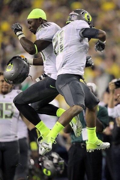 GLENDALE, AZ - JANUARY 10:  (R-L) LaMichael James #21 and Kenjon Barner #24 of the Oregon Ducks celebrate James' eight-yard touchdown reception in the second quarter against the Auburn Tigers during the Tostitos BCS National Championship Game at Universit