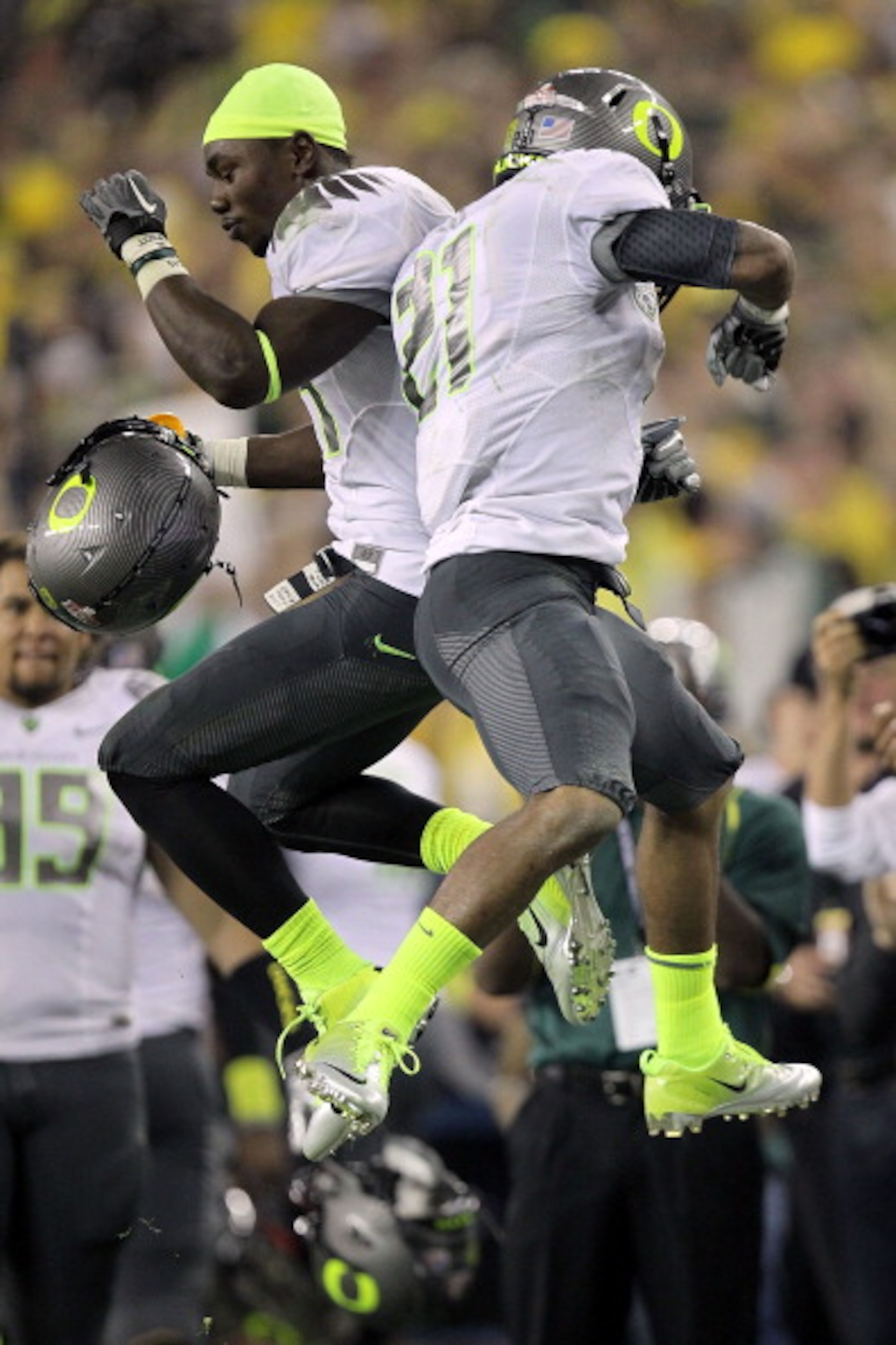 GLENDALE, AZ - JANUARY 10:  (R-L) LaMichael James #21 and Kenjon Barner #24 of the Oregon Ducks celebrate James' eight-yard touchdown reception in the second quarter against the Auburn Tigers during the Tostitos BCS National Championship Game at Universit