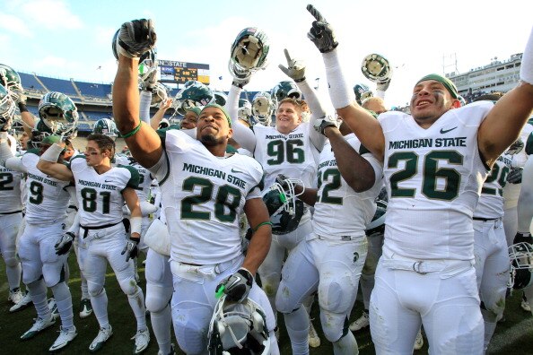STATE COLLEGE, PA - NOVEMBER 27:  Linebacker Denicos Allen #28 and teammates celebrate their Big Ten championship after a game against the Penn State Nittany Lions on November 27, 2010 at Beaver Stadium in State College, Pennsylvania. The Spartans won 28-