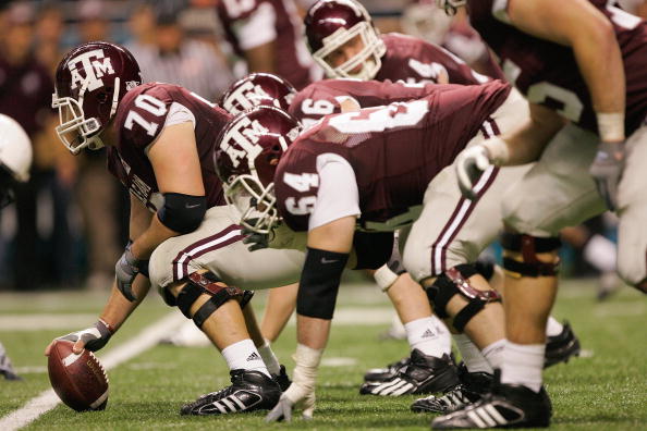 SAN ANTONIO - DECEMBER 29:  Cody Wallace #70 of the Texas A&M Aggies prepares to snap the ball against the Penn State Nittany Lions during the Valero Alamo Bowl on December 29, 2007 at the Alamodome in San Antonio, Texas.  Penn State won 24-17.  (Photo by