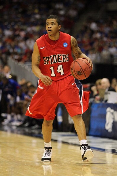 SAN ANTONIO, TX - MARCH 25:  Kevin Anderson #14 of the Richmond Spiders handles the ball against the Kansas Jayhawks during the southwest regional of the 2011 NCAA men's basketball tournament at the Alamodome on March 25, 2011 in San Antonio, Texas. Kansa