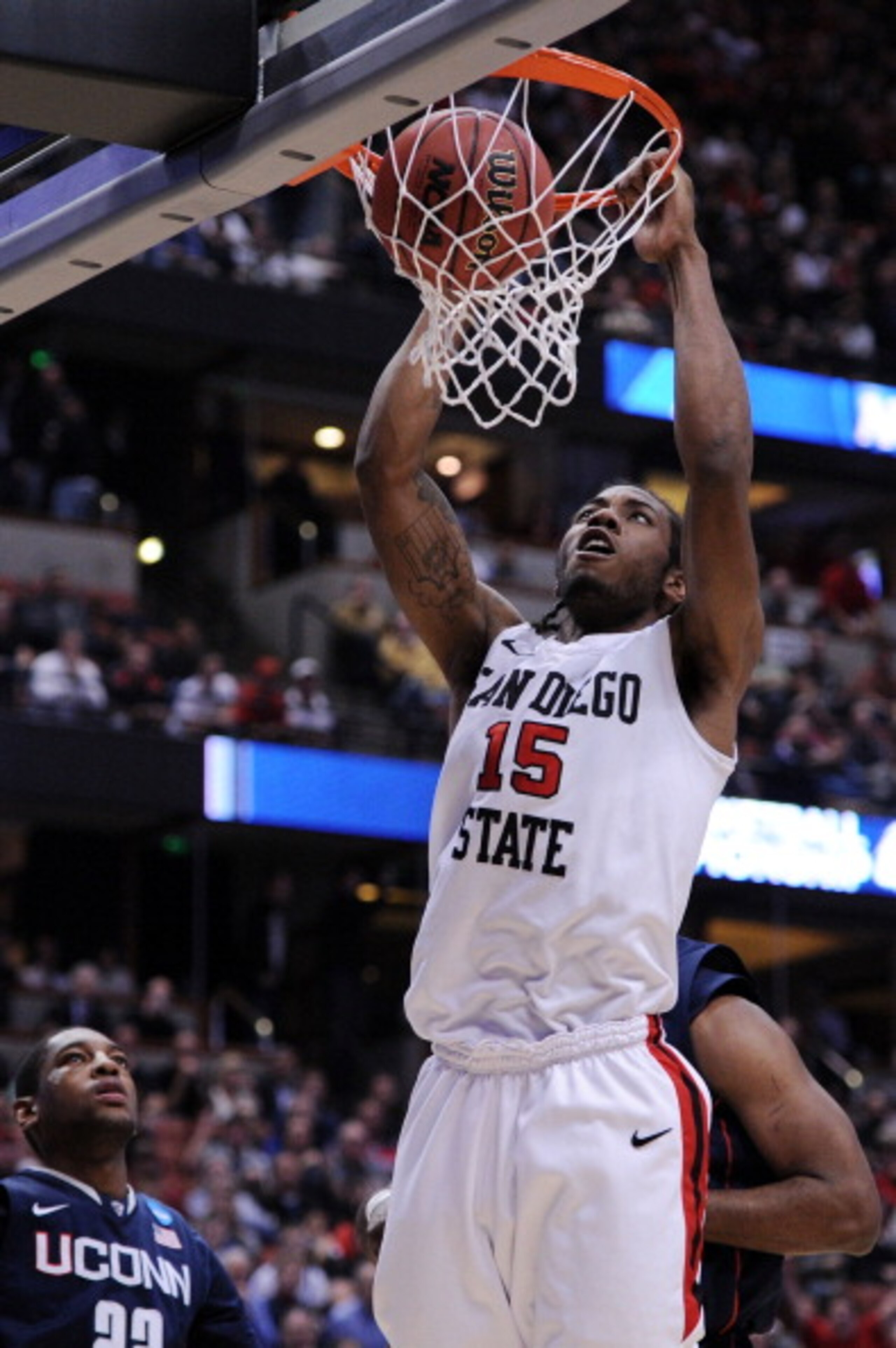 ANAHEIM, CA - MARCH 24: Kawhi Leonard #15 of the San Diego State Aztecs dunks the ball against the Connecticut Huskies during the west regional semifinal of the 2011 NCAA men's basketball tournament at the Honda Center on March 24, 2011 in Anaheim, Calif ANAHEIM, CA - MARCH 24: Kawhi Leonard #15 of the San Diego State Aztecs dunks the ball against the Connecticut Huskies during the west regional semifinal of the 2011 NCAA men's basketball tournament at the Honda Center on March 24, 2011 in Anaheim, Calif