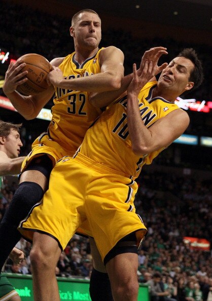 BOSTON, MA - MARCH 16:  Josh McRoberts #32 and Jeff Foster #10 of the Indiana Pacers fight for the rebound in the first half against the Boston Celtics on March 16, 2011 at the TD Garden in Boston, Massachusetts.  NOTE TO USER: User expressly acknowledges