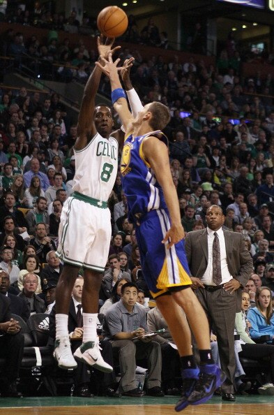 BOSTON, MA - MARCH 04:  Jeff Green #8 of the Boston Celtics takes a shot as Andris Biedrins #15 of the Golden State Warriors defends on March 4, 2011 at the TD Garden in Boston, Massachusetts.  NOTE TO USER: User expressly acknowledges and agrees that, by
