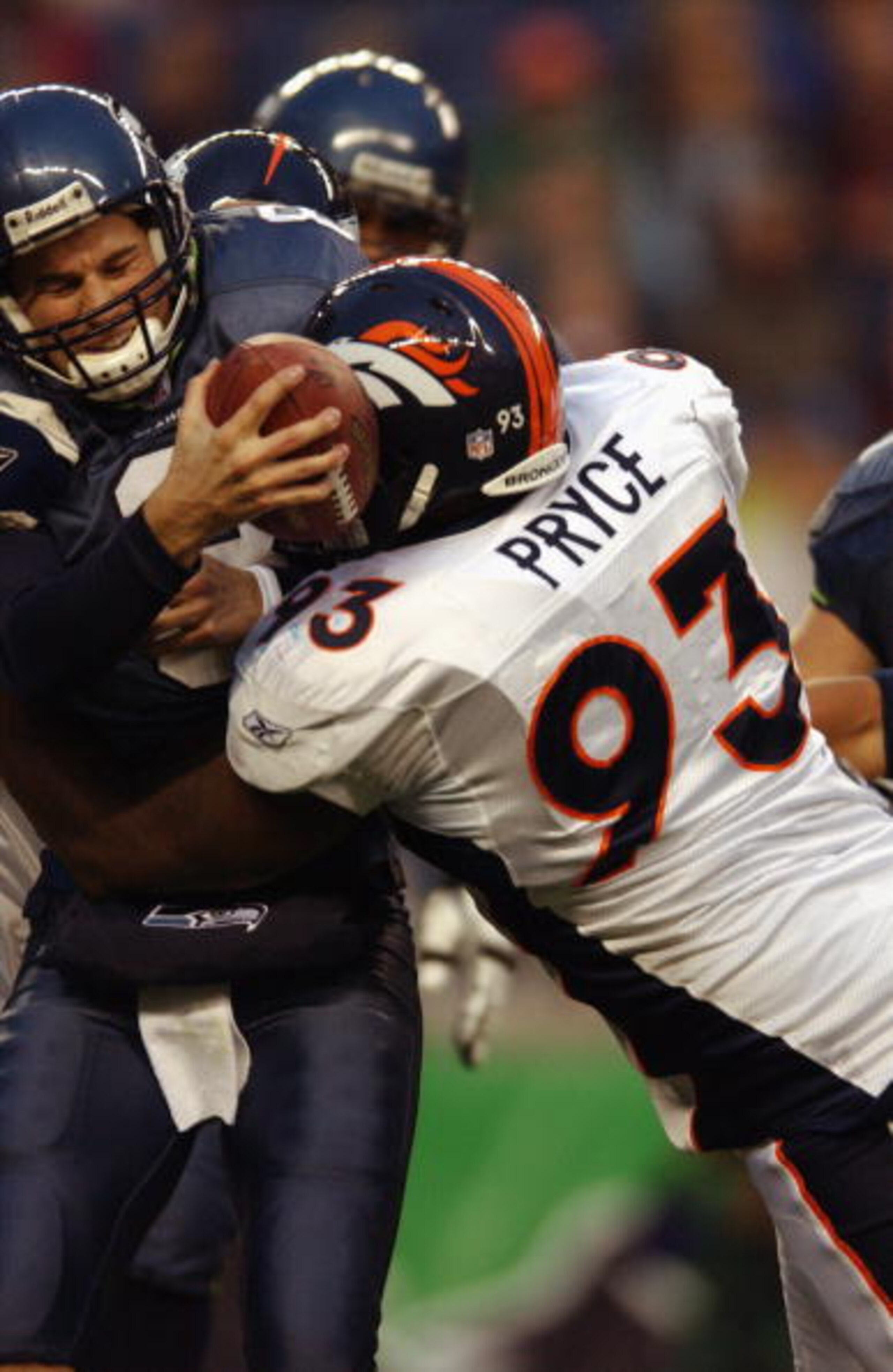 SEATTLE - NOVEMBER 17:  Quarterback Matt Hasselbeck #8 of the Seattle Seahawks is sacked by Trevor Pryce #93 of the Denver Broncos during the NFL game at Seahawks Stadium on November 17, 2002 in Seattle, Washington. The Broncos defeated the Seahawks 31-9.