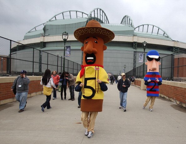 MILWAUKEE, WI - APRIL 04: Members of the 'racing sausages' walk out to greet fans before the home opener between the Atlanta Braves and the Milwaukee Brewers at Miller Park on April 4, 2011 in Milwaukee, Wisconsin. (Photo by Jonathan Daniel/Getty Images)