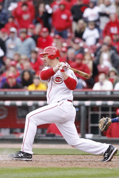 CINCINNATI, OH - MARCH 31: Scott Rolen #27 of the Cincinnati Reds hits the ball in the ninth inning against the Milwaukee Brewers in the opening day game at Great American Ballpark on March 31, 2011 in Cincinnati, Ohio. The Reds won 7-6. (Photo by Joe Rob