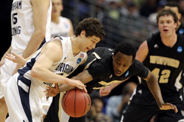 DENVER, CO - MARCH 17:  Jamar Diggs #5 of the Wofford Terriers defends against Jimmer Fredette #32 of the Brigham Young Cougars during the second round of the 2011 NCAA men's basketball tournament at Pepsi Center on March 17, 2011 in Denver, Colorado.  (P