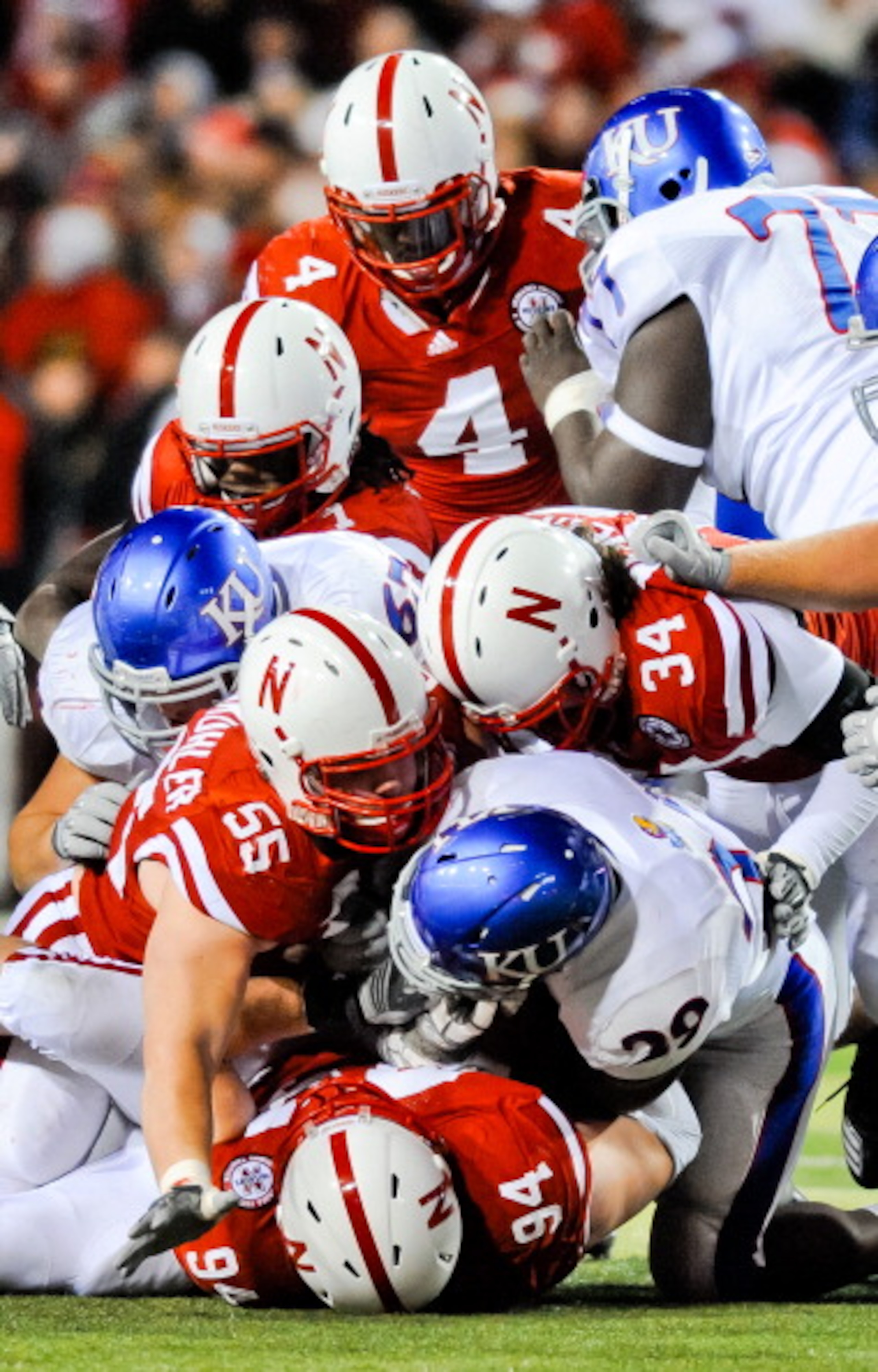 LINCOLN, NE - NOVEMBER 13: The Nebraska Cornhusker defense swarms James Sims #29 of the Kansas Jayhawks during their game at Memorial Stadium on November 13, 2010 in Lincoln, Nebraska. Nebraska Defeated Kansas 20-3. (Photo by Eric Francis/Getty Images) LINCOLN, NE - NOVEMBER 13: The Nebraska Cornhusker defense swarms James Sims #29 of the Kansas Jayhawks during their game at Memorial Stadium on November 13, 2010 in Lincoln, Nebraska. Nebraska Defeated Kansas 20-3. (Photo by Eric Francis/Getty Images)