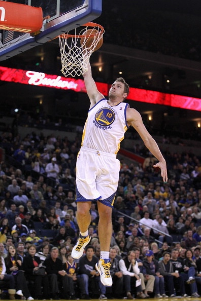 OAKLAND, CA - MARCH 25:  David Lee #10 of the Golden State Warriors in action against the Toronto Raptors at Oracle Arena on March 25, 2011 in Oakland, California. NOTE TO USER: User expressly acknowledges and agrees that, by downloading and or using this
