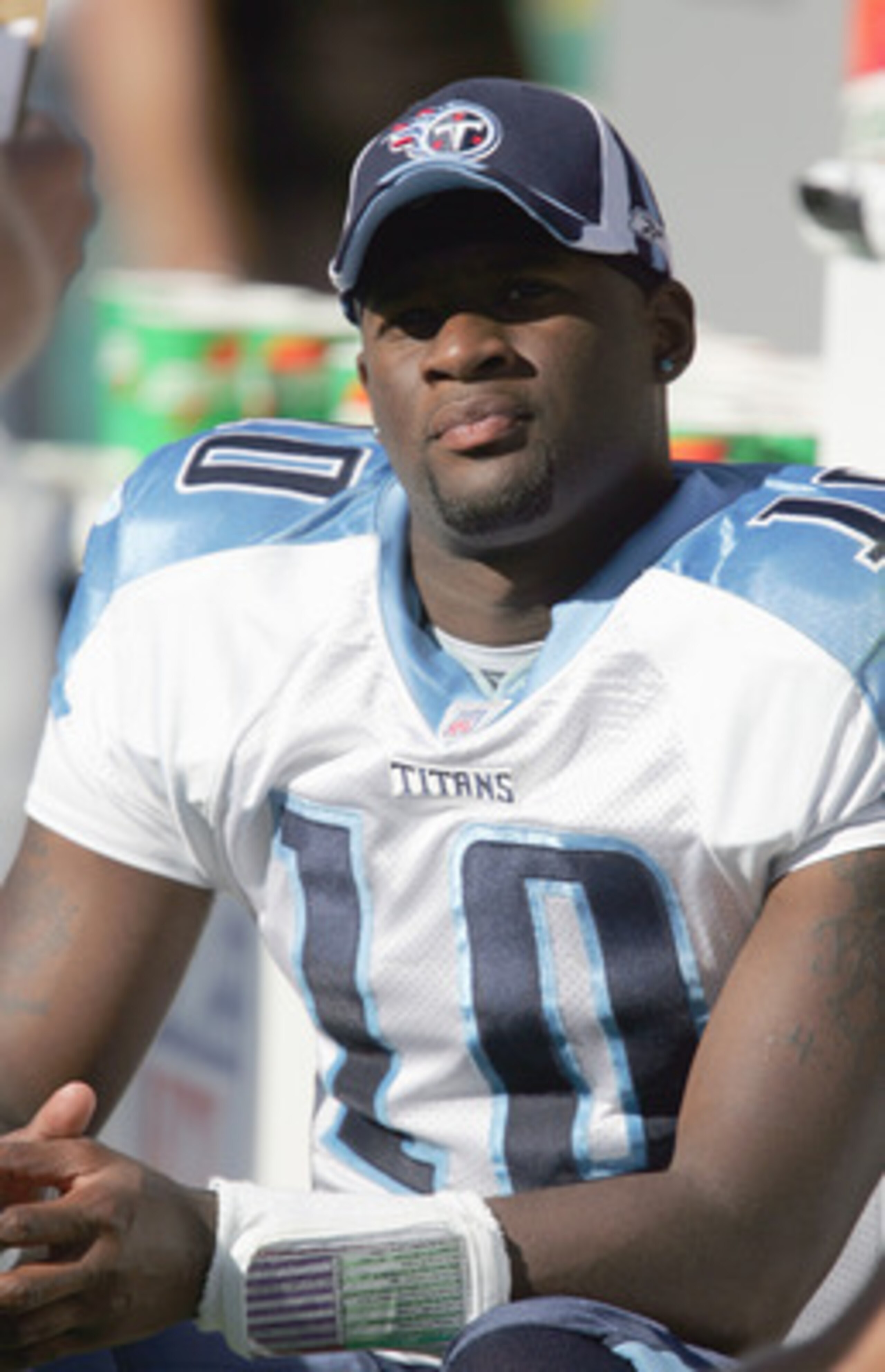 GREEN BAY, WI - SEPTEMBER 1: Vince Young #10 of the Tennessee Titans looks on from the bench during a game against the Green Bay Packers during a preseason game on September 1, 2006 at Lambeau Field in Green Bay, Wisconsin. (Photo by Jonathan Daniel/Getty