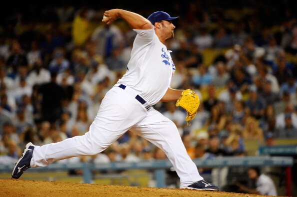 LOS ANGELES, CA - MARCH 31:  Jonathan Broxton #51 of the Los Angeles Dodgers throws a pitch in the ninth inning against the San Francisco Giants on Opening Day at Dodger Stadium on March 31, 2011 in Los Angeles, California.  (Photo by Kevork Djansezian/Ge