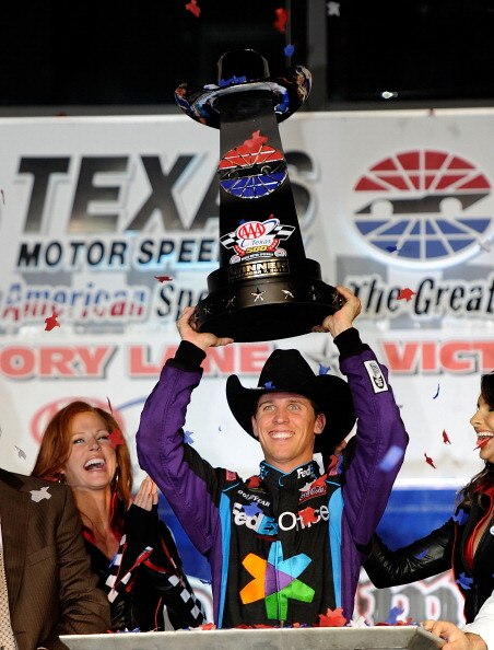 FORT WORTH, TX - NOVEMBER 07:  Denny Hamlin, driver of the #11 FedEx Office Toyota, celebrates after winning the NASCAR Sprint Cup Series AAA Texas 500 at Texas Motor Speedway on November 7, 2010 in Fort Worth, Texas.  (Photo by John Harrelson/Getty Image