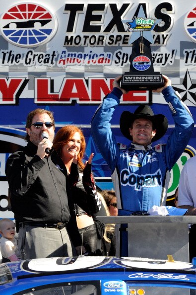 FORT WORTH, TX - NOVEMBER 06:  Carl Edwards (R), driver of the #60 Copart.com Ford, celebrates with Texas Motor Speedway President Eddie Gossage (L) in Victory Lane after winning the NASCAR Nationwide Series O'Reilly Auto Parts Challenge at Texas Motor Sp